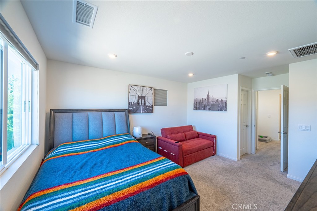 202 Bonita Lane Rialto, CA 92376 - Photo 21 of 43 a room with furniture and a window