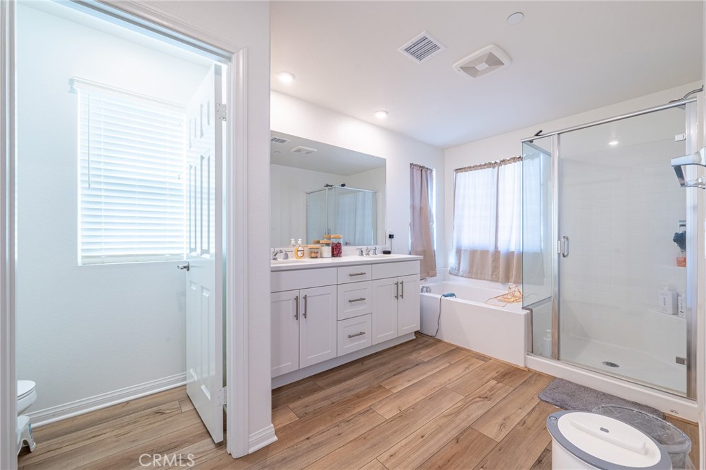 202 Bonita Lane Rialto, CA 92376 - Photo 22 of 43 a bathroom with a sink a toilet and shower