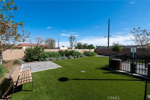 a view of a backyard with sitting area