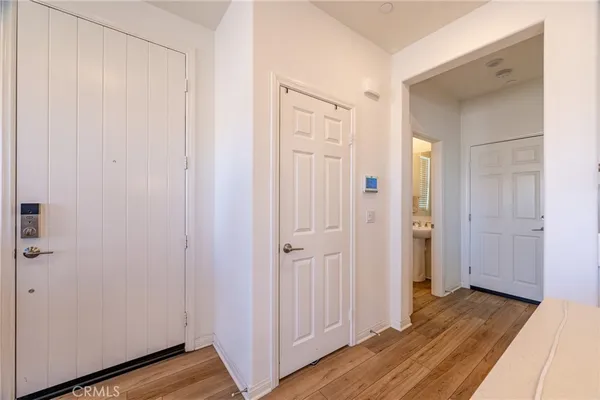 a view of a hallway with wooden floor