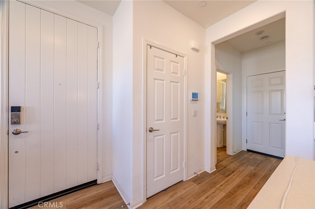 202 Bonita Lane Rialto, CA 92376 - Photo 5 of 43 a view of a hallway with wooden floor
