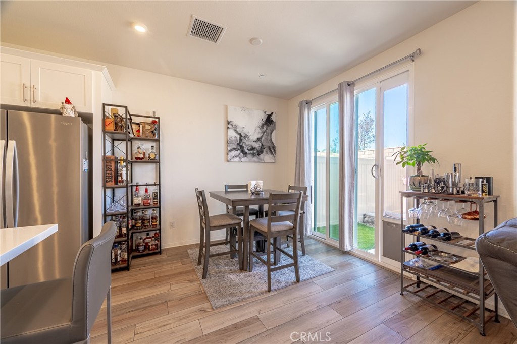 202 Bonita Lane Rialto, CA 92376 - Photo 8 of 43 a workspace with furniture window and wooden floor