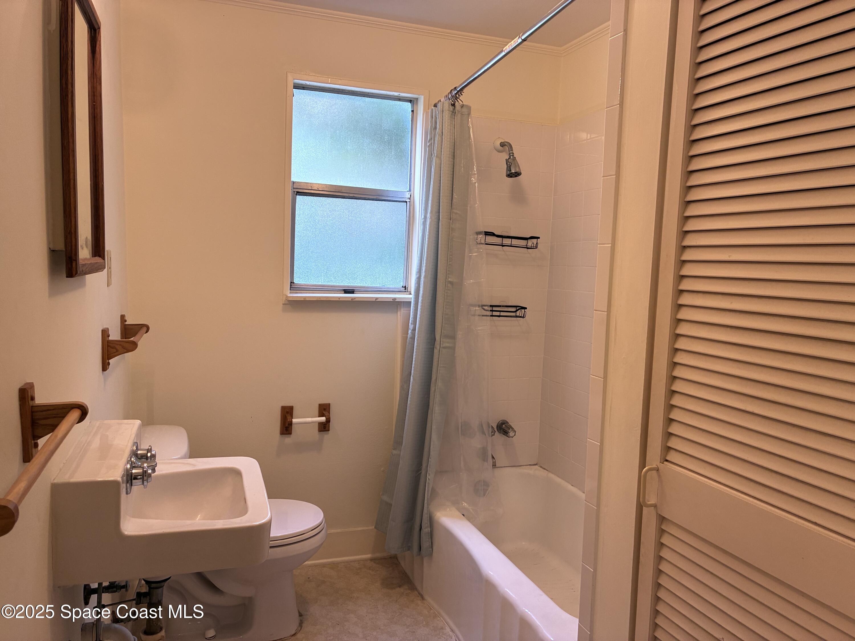 803 Rockledge Drive, Unit 2 Rockledge, FL 32955 - Photo 11 of 15 a bathroom with a sink toilet and shower