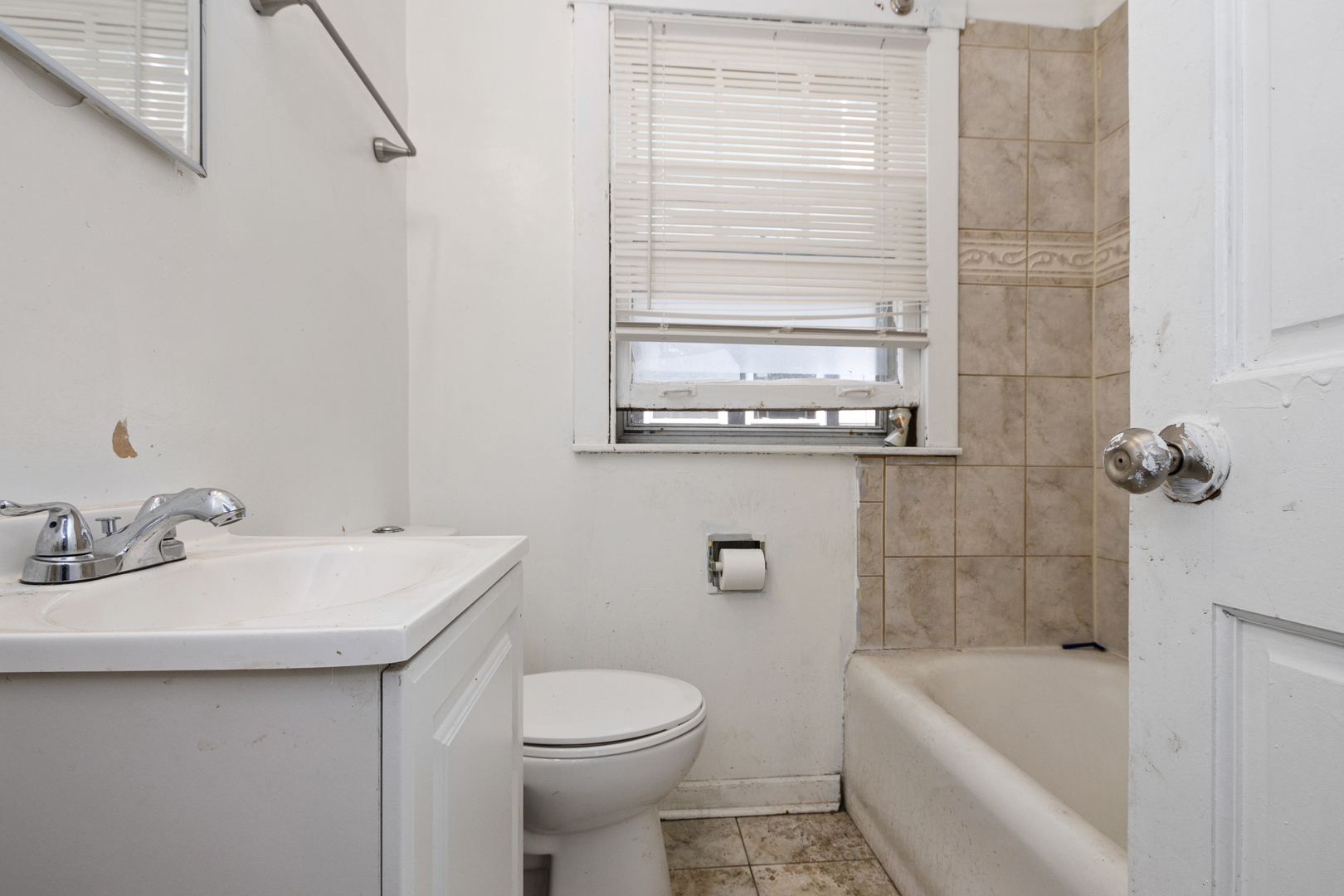 12050 South Yale Avenue Chicago, IL 60628 - Photo 13 of 24 a bathroom with a sink a toilet and shower