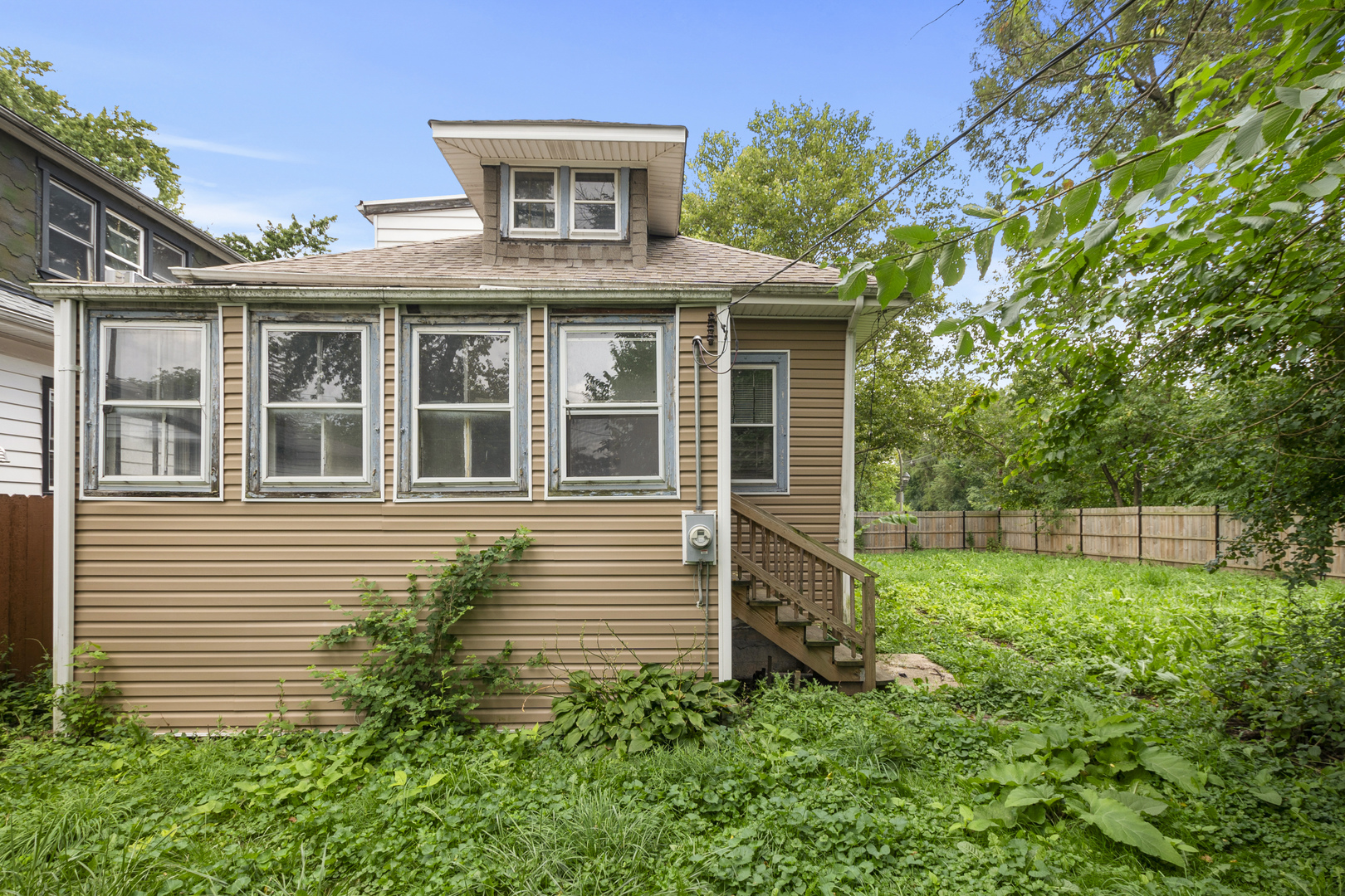 12050 South Yale Avenue Chicago, IL 60628 - Photo 24 of 24 a front view of a house with a yard