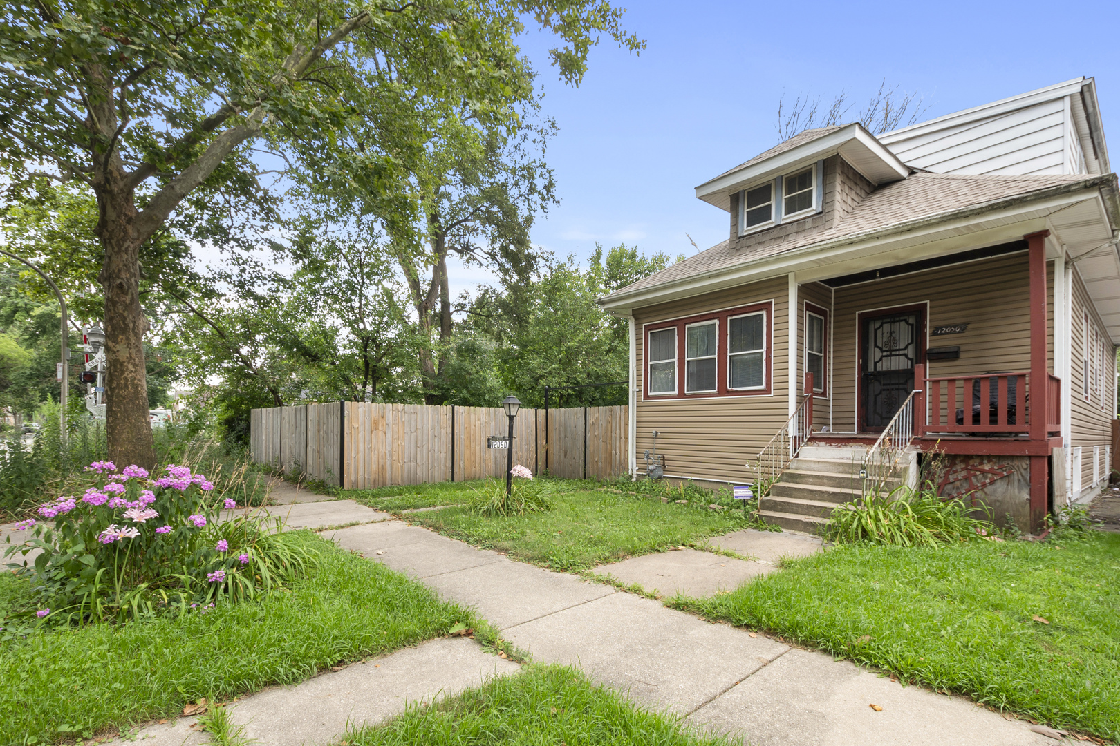 12050 South Yale Avenue Chicago, IL 60628 - Photo 4 of 24 a front view of house with yard