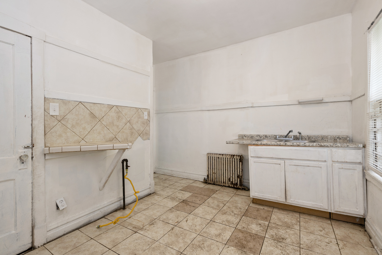 12050 South Yale Avenue Chicago, IL 60628 - Photo 9 of 24 a utility room with cabinets washer and dryer