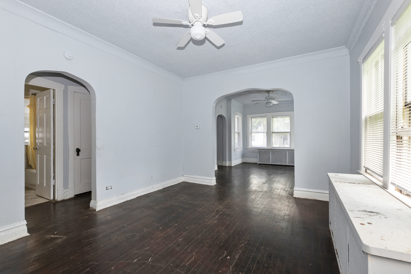 12050 South Yale Avenue Chicago, IL 60628 - Photo 10 of 24 wooden floor in an empty room with a window