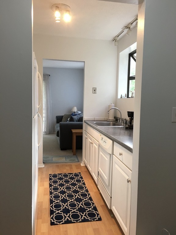 1 Round House Road, Unit 1 Bourne, MA 02532 - Photo 4 of 11 a kitchen with a sink and a stove top oven