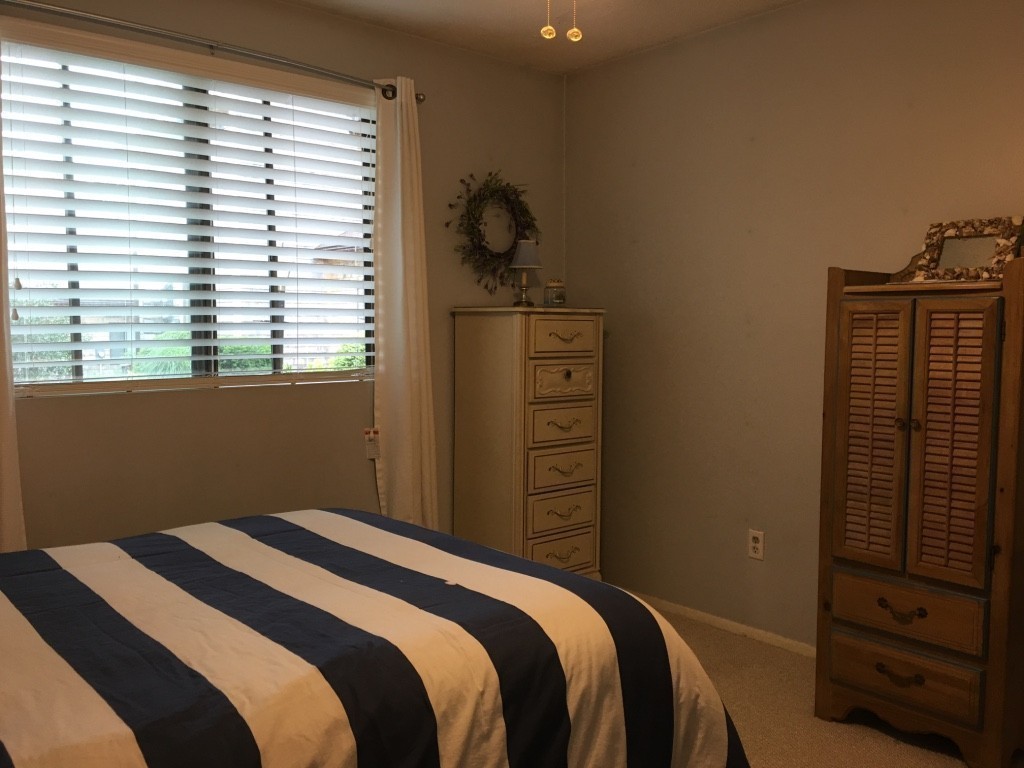 1 Round House Road, Unit 1 Bourne, MA 02532 - Photo 7 of 11 a bedroom with a bed and a window