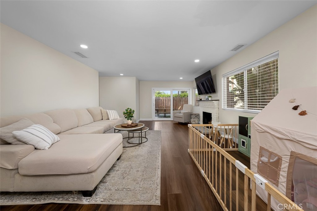 4773 Adler Way Oceanside, CA 92057 - Photo 18 of 29 a living room with furniture fireplace and a large window