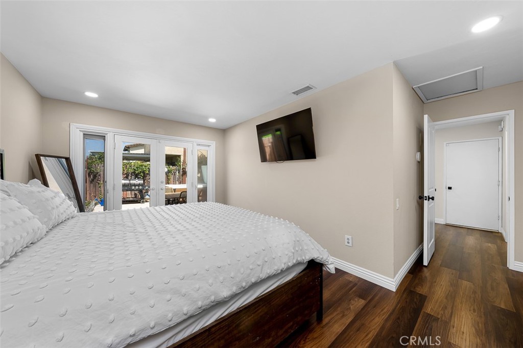 4773 Adler Way Oceanside, CA 92057 - Photo 20 of 29 a bedroom with a bed and a flat screen tv