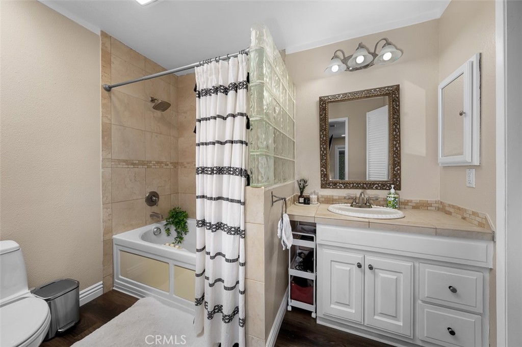 4773 Adler Way Oceanside, CA 92057 - Photo 22 of 29 a bathroom with a sink a toilet and shower