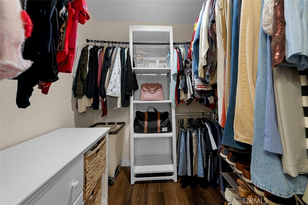 4773 Adler Way Oceanside, CA 92057 - Photo 24 of 29 a view of walk in closet with clothes and shoes