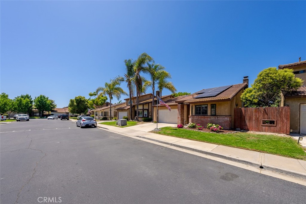 4773 Adler Way Oceanside, CA 92057 - Photo 28 of 29 a front view of a house with a yard and garage