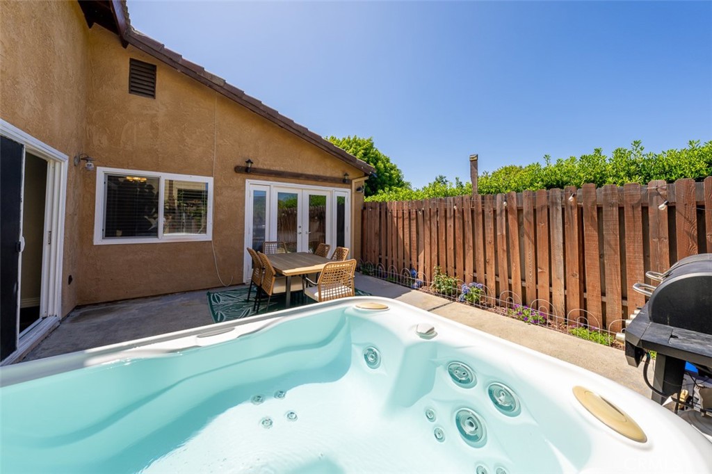 4773 Adler Way Oceanside, CA 92057 - Photo 6 of 29 a backyard of a house with table and chairs