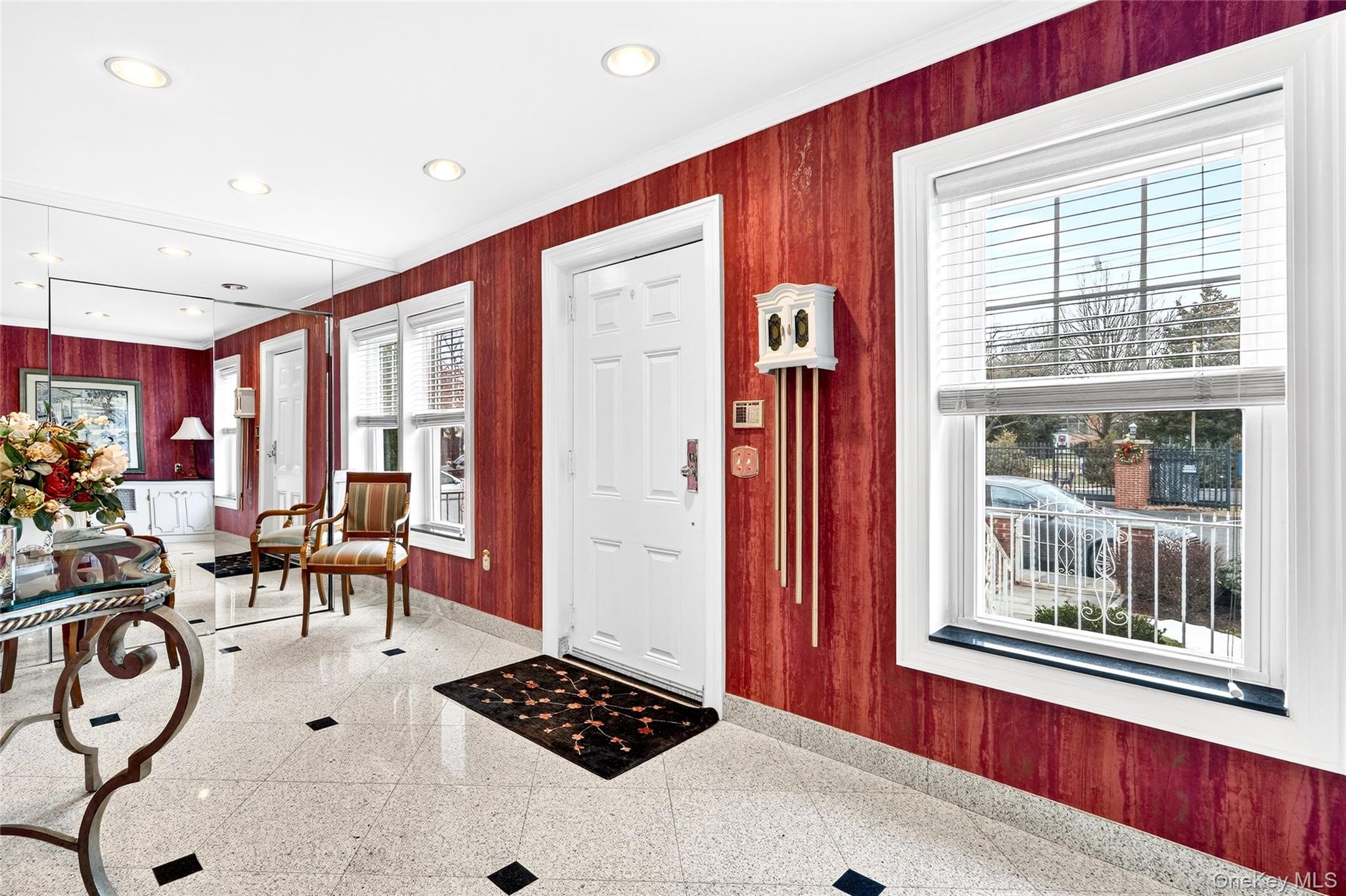 3334 Country Club Road Bronx, NY 10465 - Photo 5 of 49 Entryway featuring wooden walls, crown molding, and recessed lighting