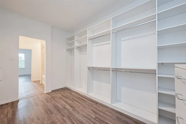 a view of an empty walk in closet