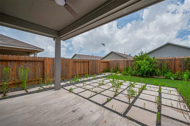 a backyard of a house with lots of green space
