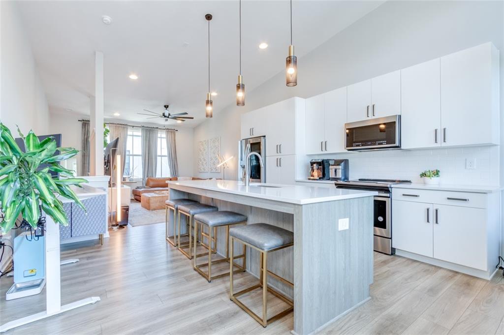 912 Brees Court Atlanta, GA 30318 - Photo 11 of 33 a kitchen with counter space appliances and wooden floor