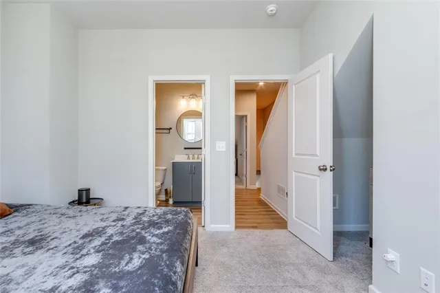 a bathroom with a toilet a sink and a mirror