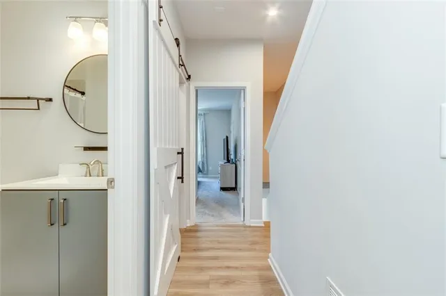 a view of a hallway with washer and dryer