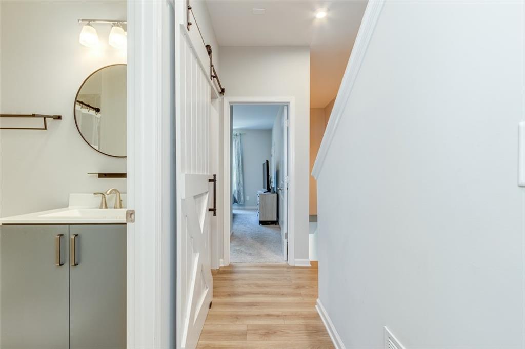 912 Brees Court Atlanta, GA 30318 - Photo 22 of 33 a view of a hallway with wooden floor
