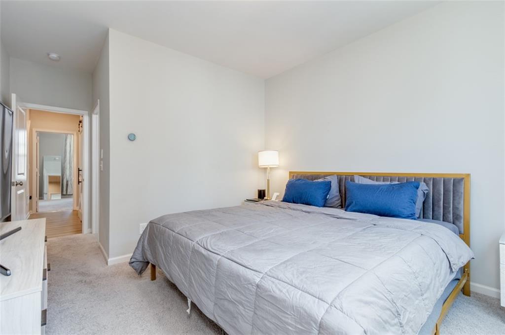 912 Brees Court Atlanta, GA 30318 - Photo 29 of 33 a bedroom with a bed and closet