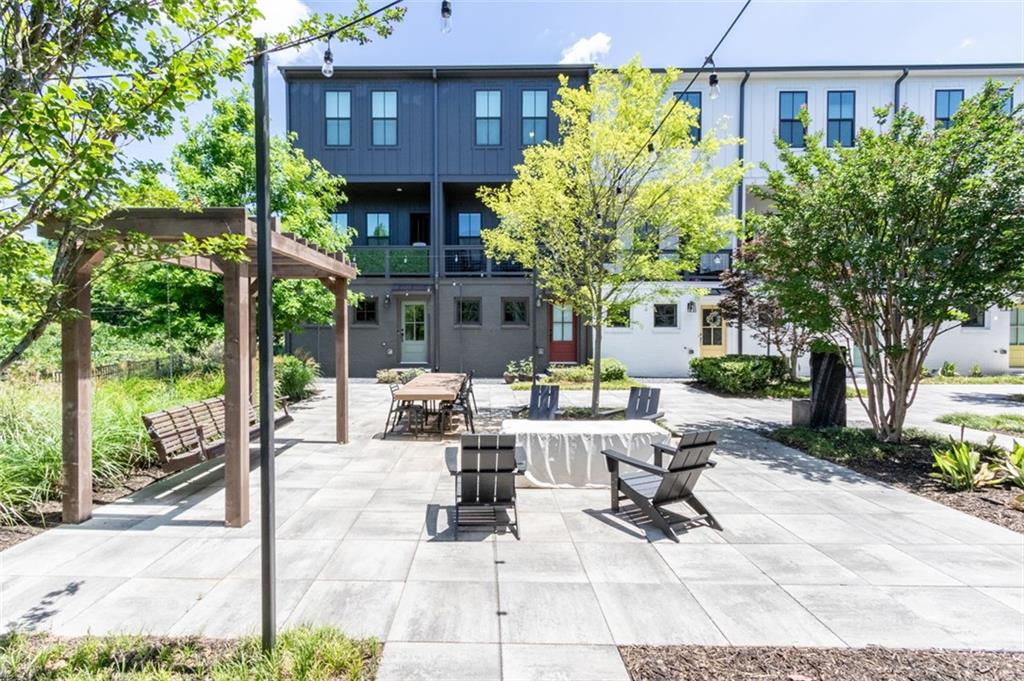 912 Brees Court Atlanta, GA 30318 - Photo 32 of 33 a building outdoor space with patio furniture and potted plants