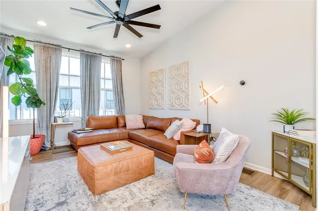 a living room with furniture and a large window