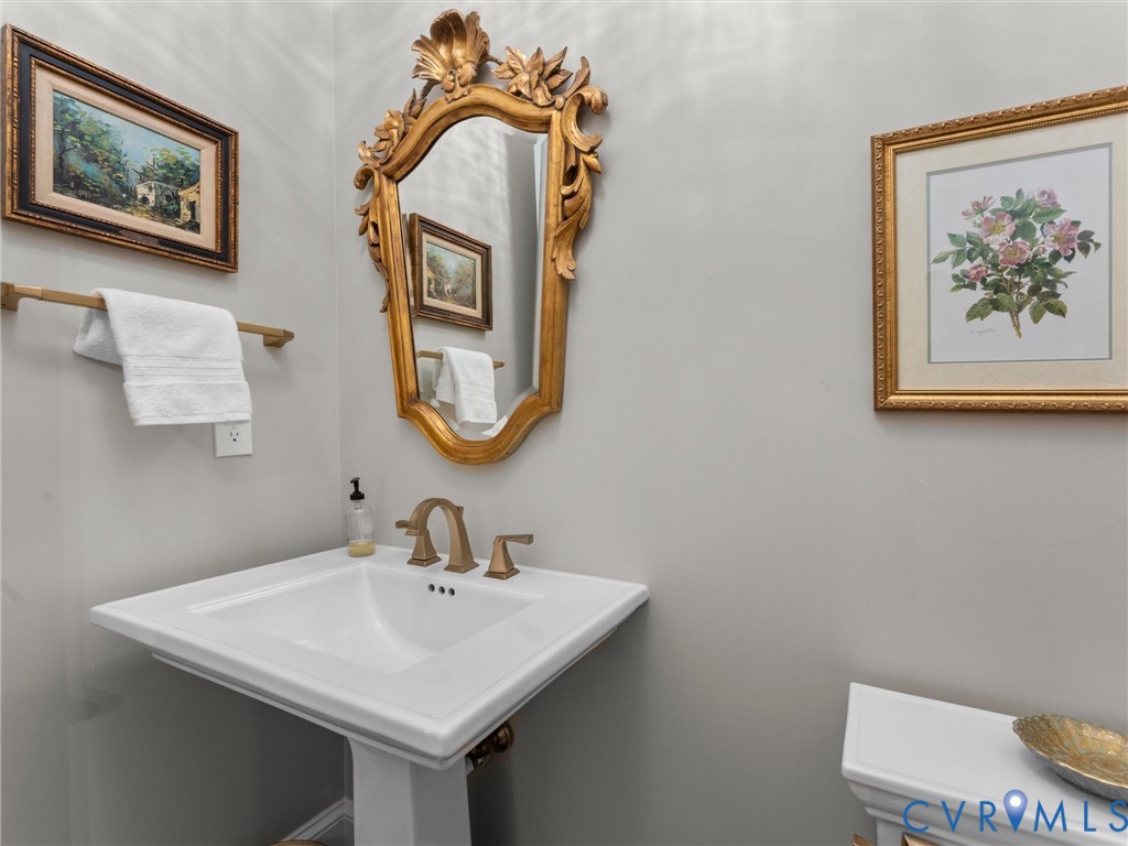 16131 Binley Road Midlothian, VA 23112 - Photo 42 of 99 a bathroom with a sink and a mirror