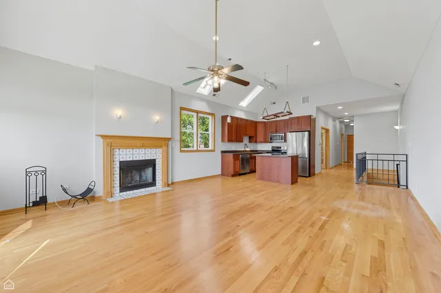 a large kitchen with cabinets and a fireplace