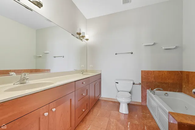 a bathroom with a sink a toilet and bathtub