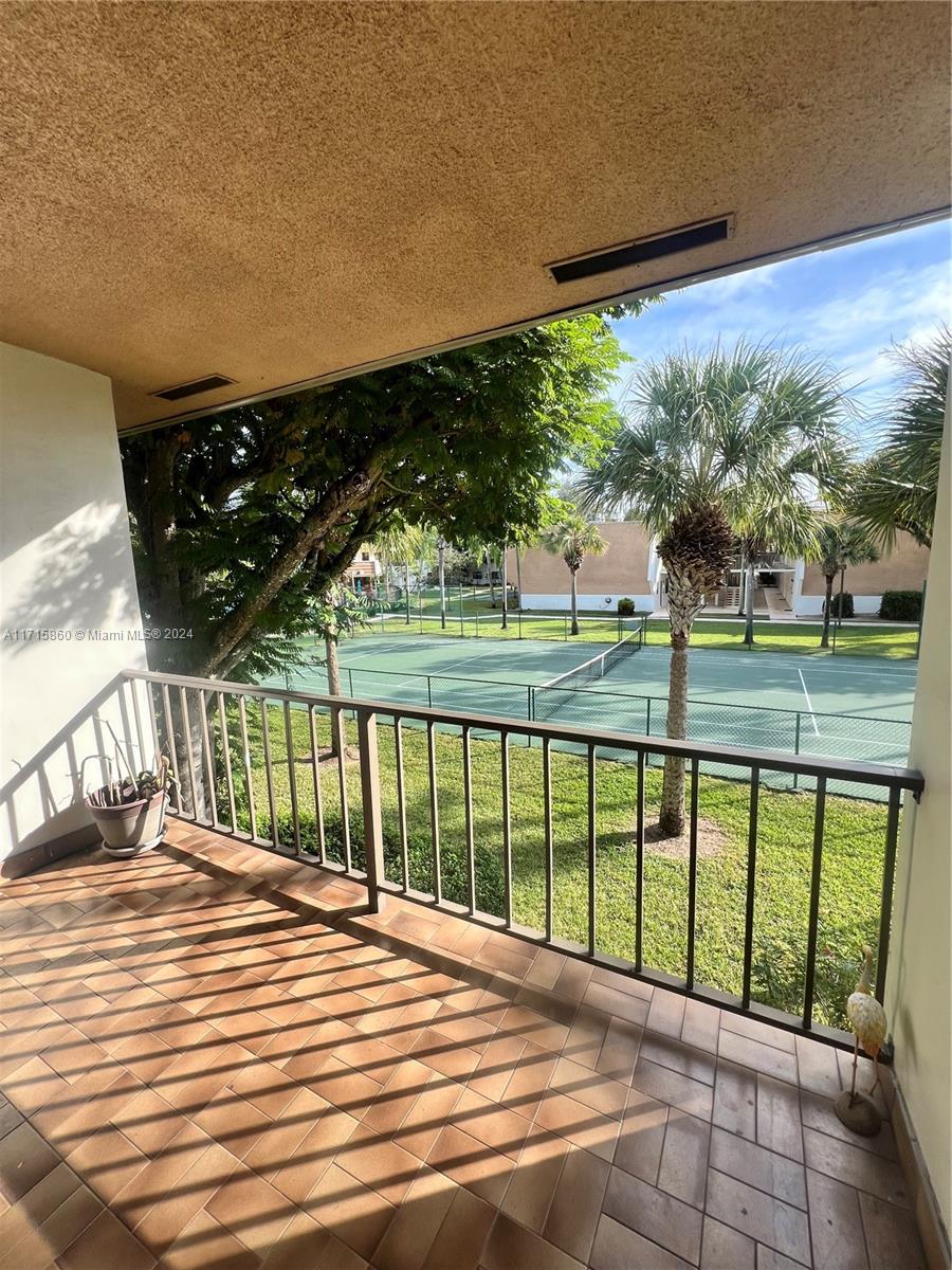 8281 Southwest 128th Street, Unit 213 Pinecrest, FL 33156 - Photo 8 of 8 a view of a porch