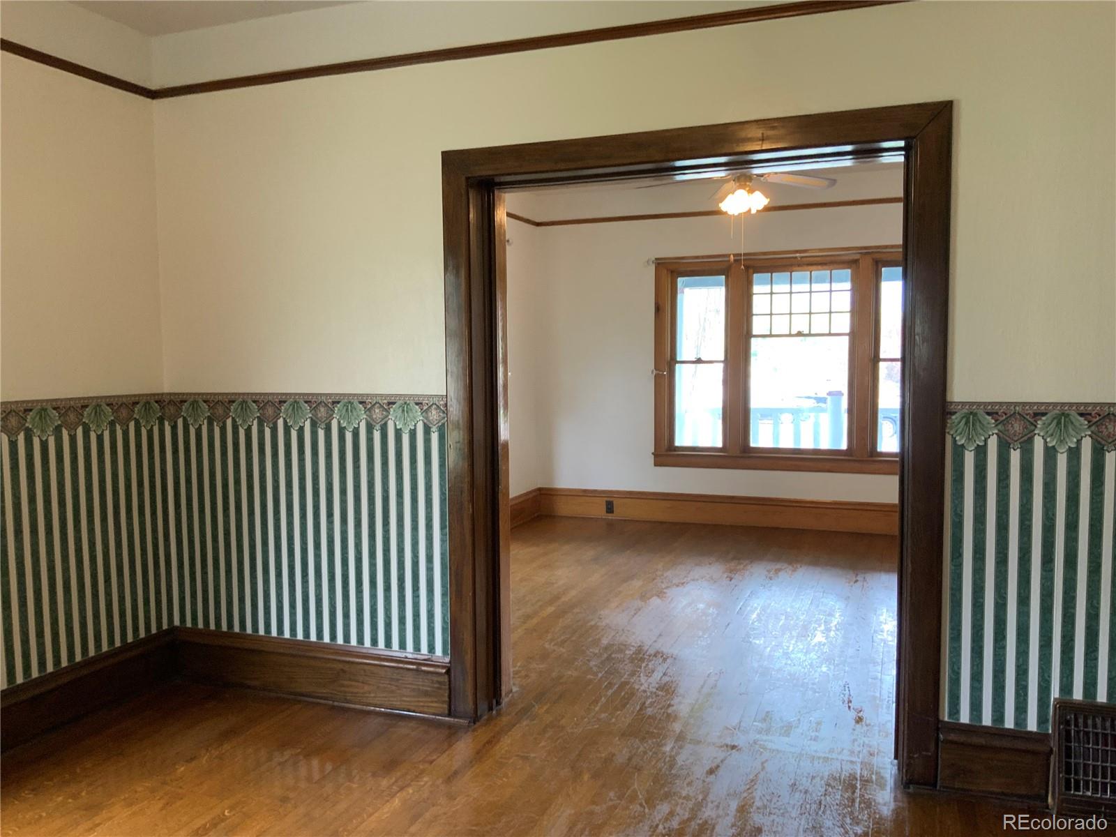 1011 Main Street Meeker, CO 81641 - Photo 8 of 28 a view of a room with wooden floor and a window