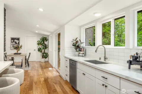 a kitchen with sink and window