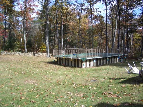 31 Popple Camp Road Petersham, MA 01366 - Photo 2 of 3 a view of a house with a small yard and sitting area