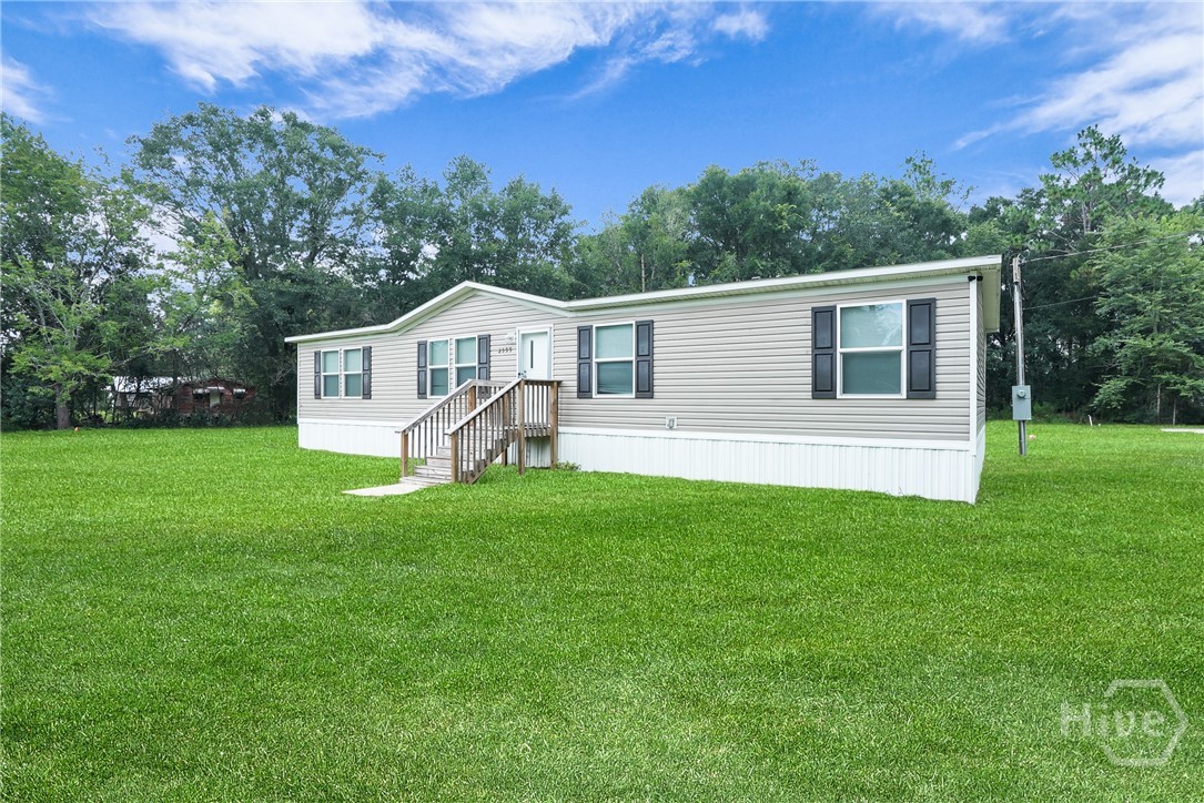 2599 Black Creek Church Road Ellabell, GA 31308 - Photo 2 of 40 Side view of home
