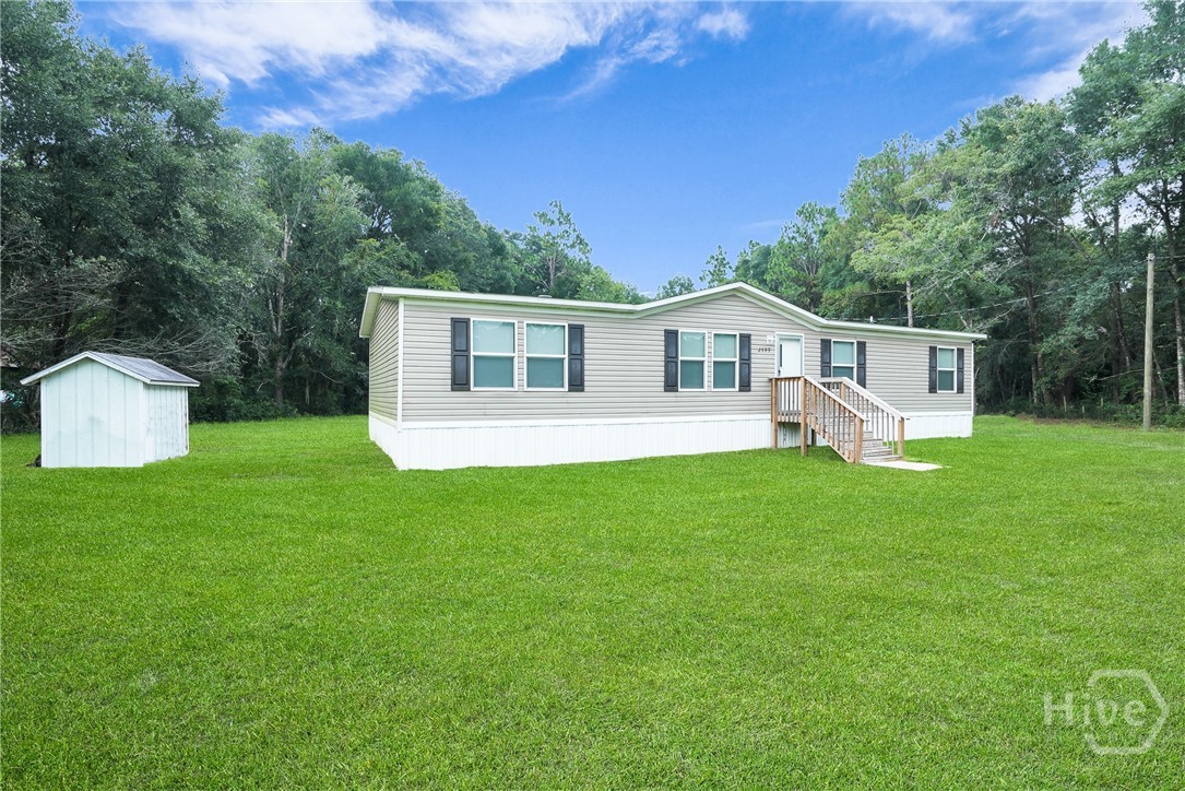 2599 Black Creek Church Road Ellabell, GA 31308 - Photo 3 of 40 Side view of home