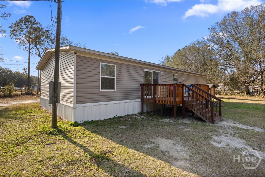 2599 Black Creek Church Road Ellabell, GA 31308 - Photo 32 of 40 Back view of home and newly built back porch