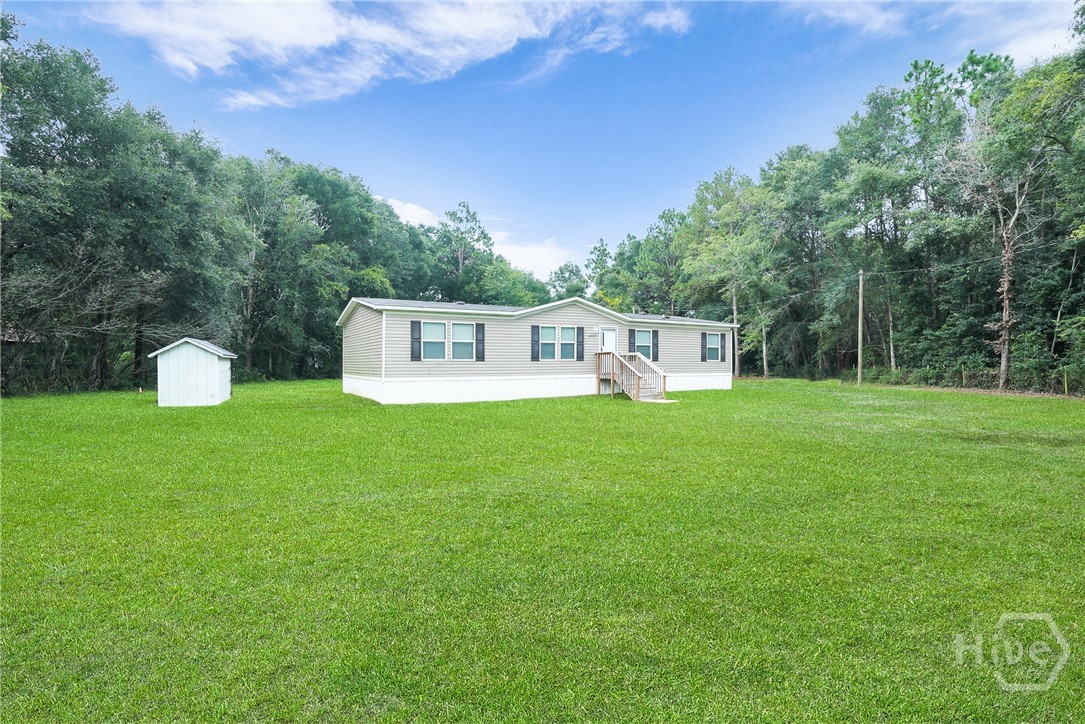 2599 Black Creek Church Road Ellabell, GA 31308 - Photo 5 of 40 Side view of home