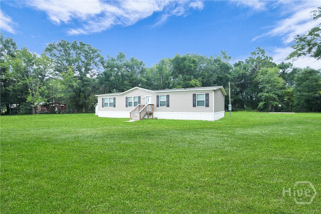 2599 Black Creek Church Road Ellabell, GA 31308 - Photo 6 of 40 Side view of home
