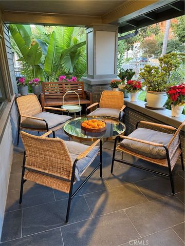 a kitchen with kitchen island wooden floor stainless steel appliances and cabinets