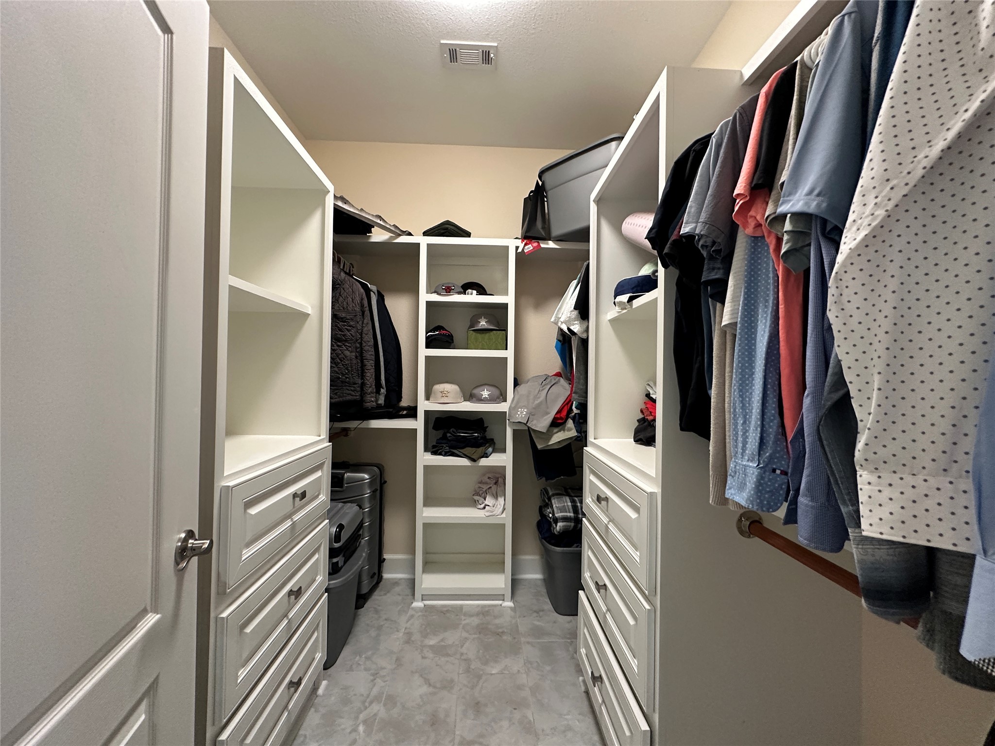 4334 Maass Road Burton, TX 77835 - Photo 11 of 44 a view of walk in closet with clothes