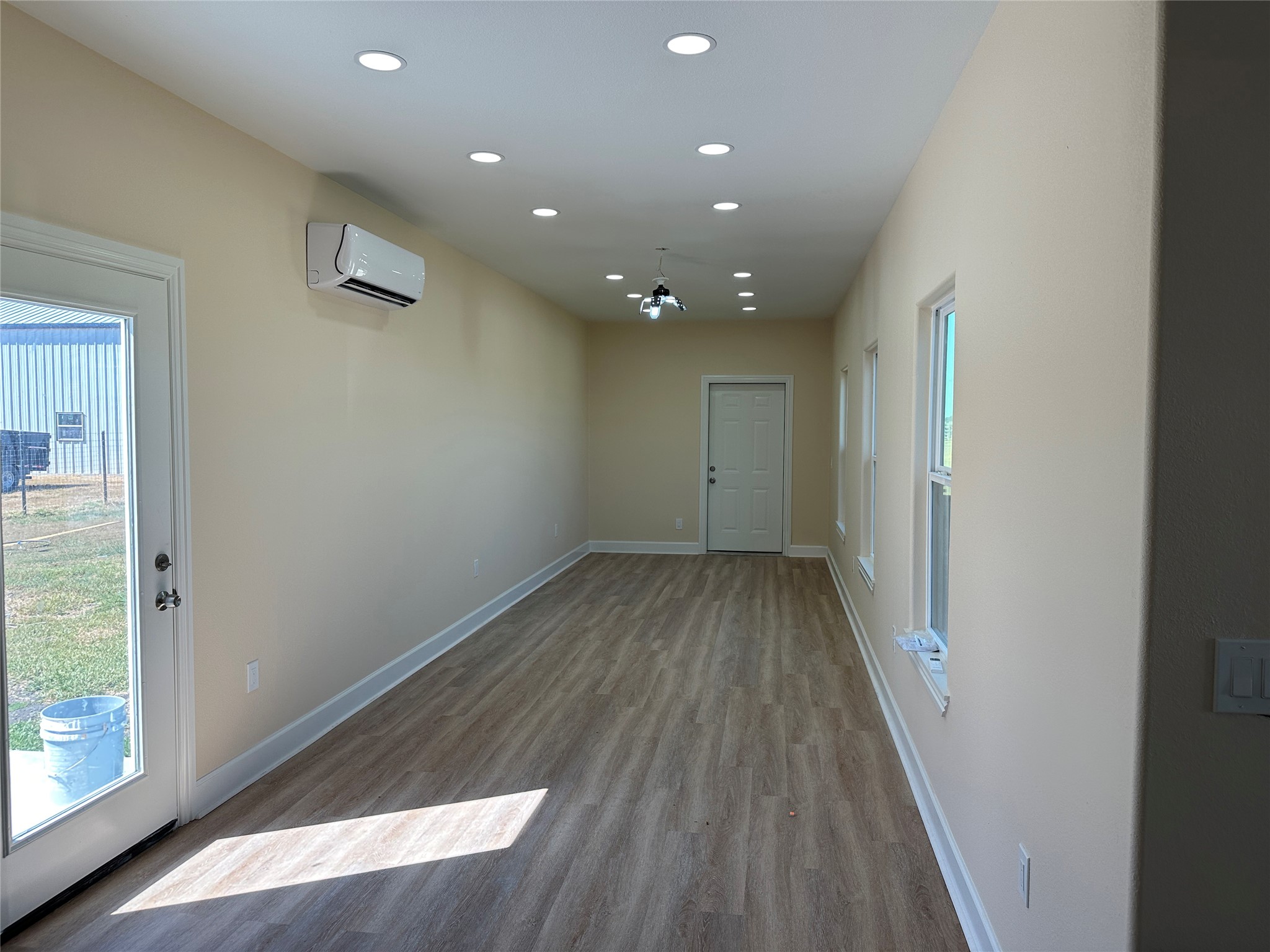 4334 Maass Road Burton, TX 77835 - Photo 19 of 44 a view of hallway with wooden floor