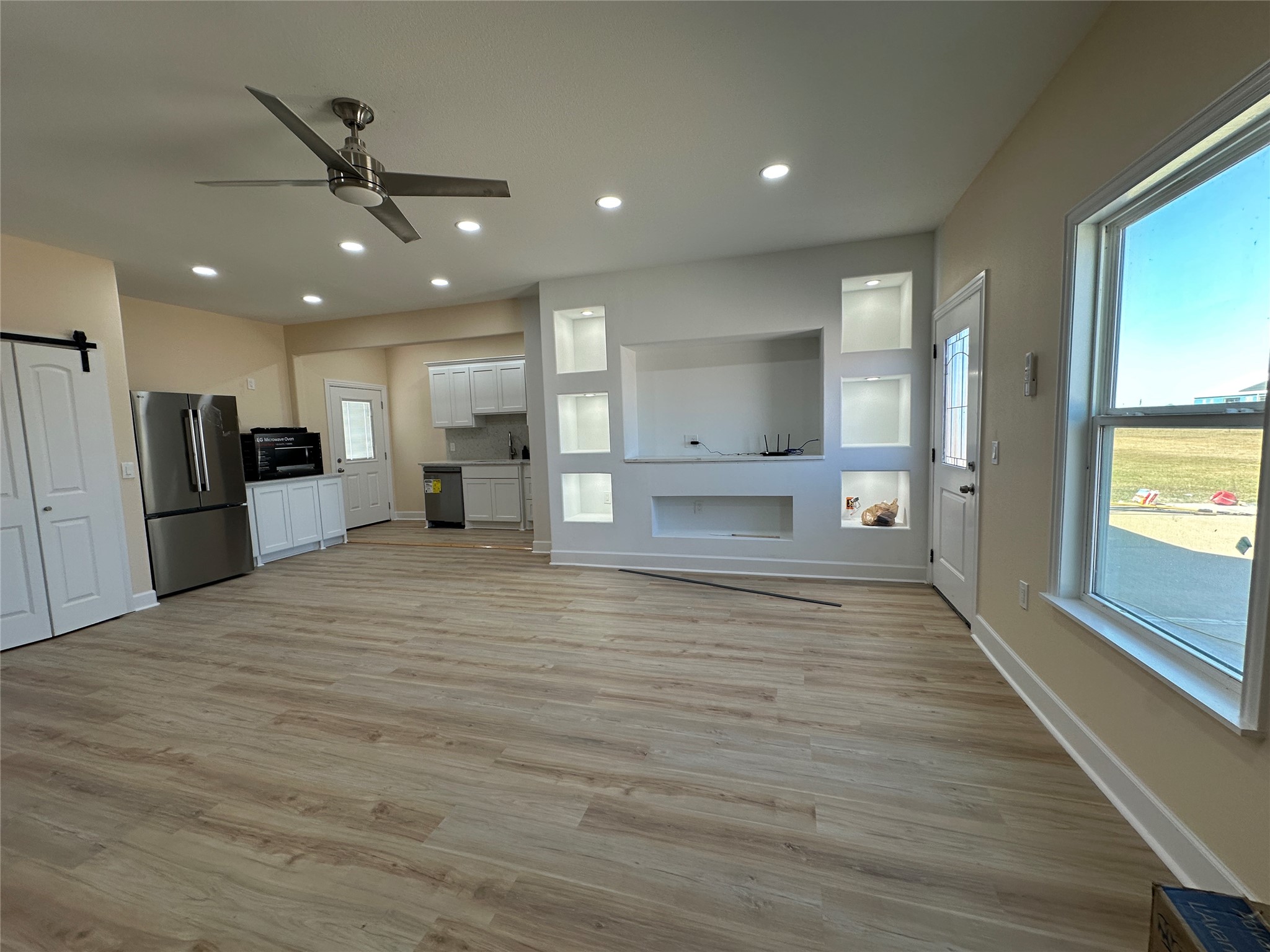 4334 Maass Road Burton, TX 77835 - Photo 21 of 44 a view of an empty room and kitchen view