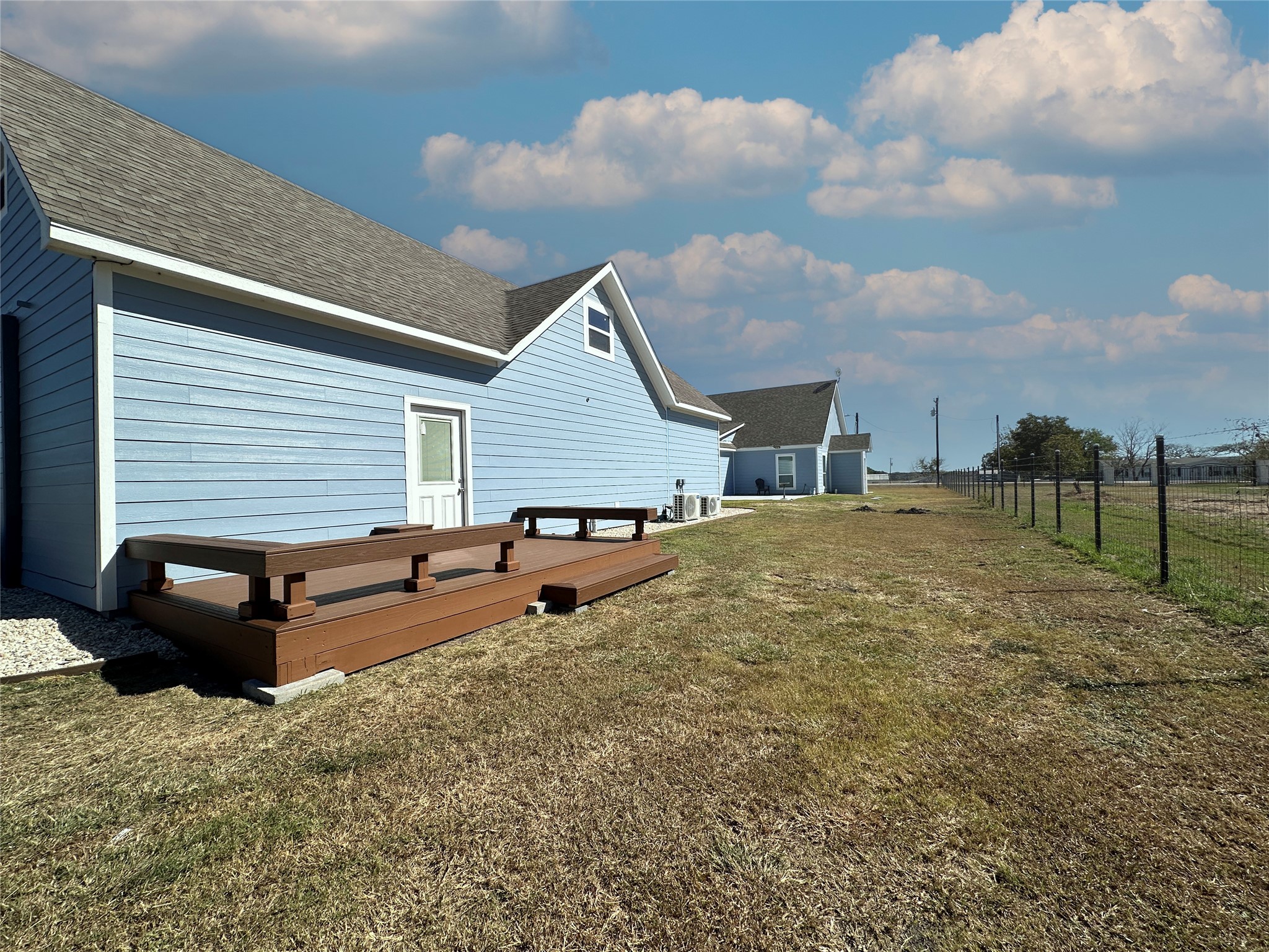 4334 Maass Road Burton, TX 77835 - Photo 40 of 44 a backyard of a house with table and sofas