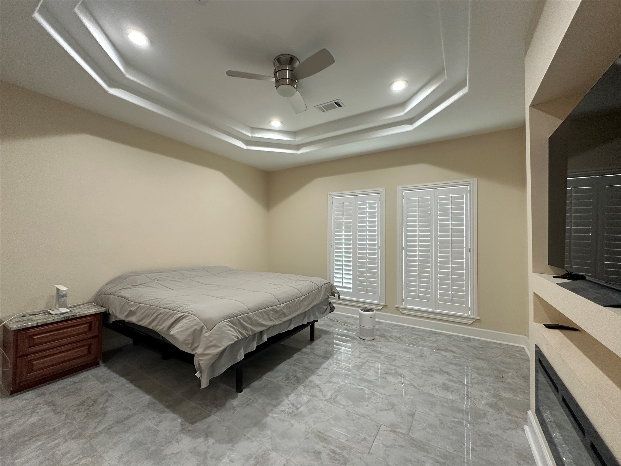 4334 Maass Road Burton, TX 77835 - Photo 7 of 44 a spacious bedroom with a bed and a flat screen tv