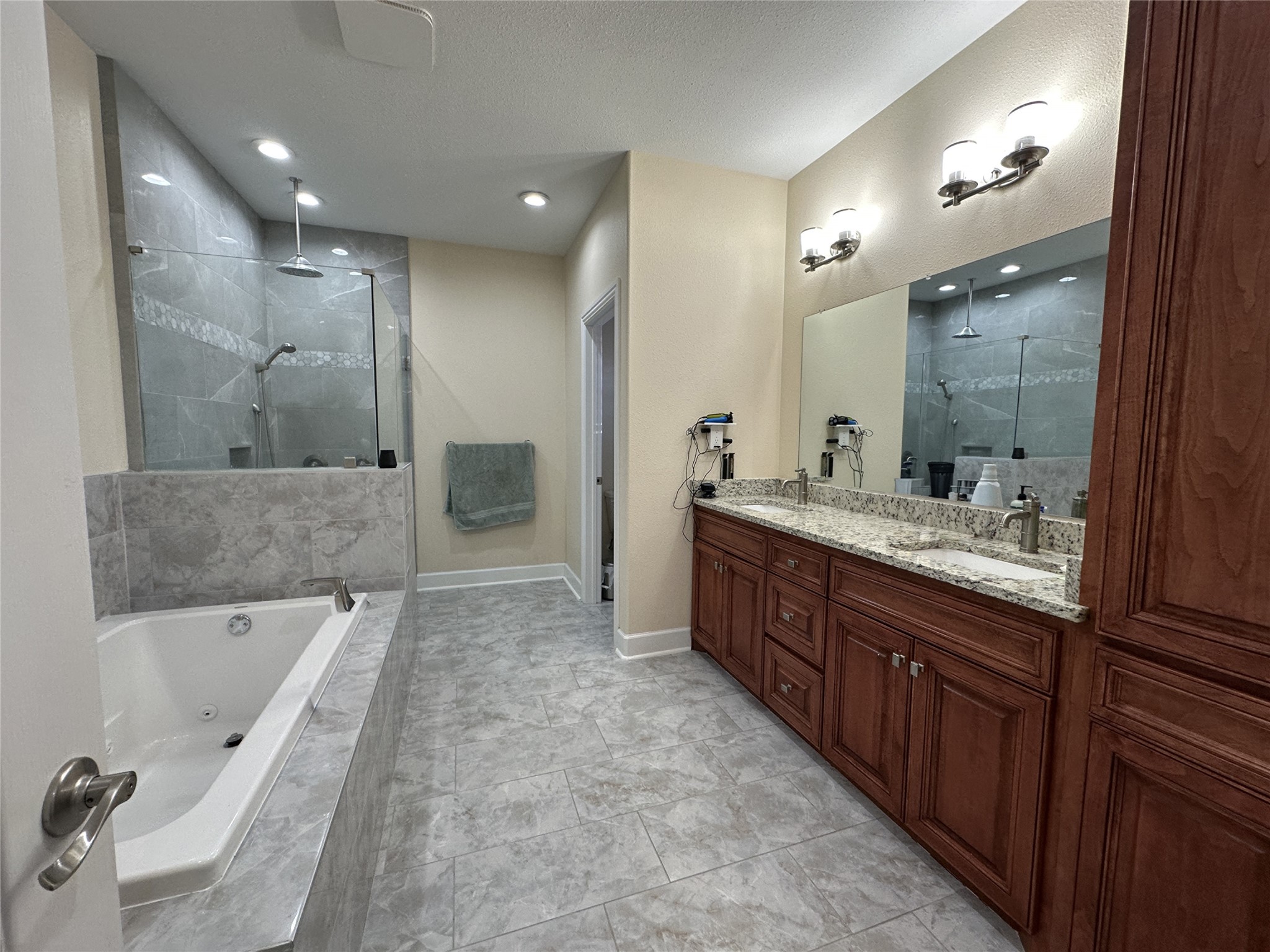 4334 Maass Road Burton, TX 77835 - Photo 9 of 44 a spacious bathroom with a tub sink shower and mirror