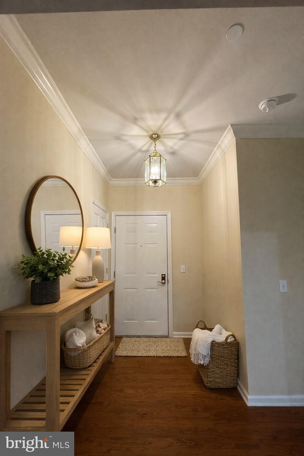 a bathroom with a mirror and vanity